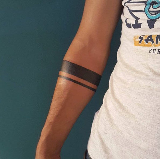 The Meaning Behind Two Band Arm Tattoos